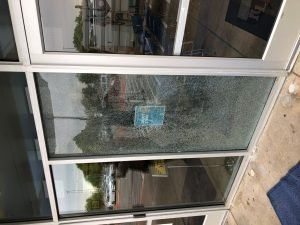 Commercial storefront glass repair - BEFORE - by Austin Sliding Door and Window Repair, Austin, TX